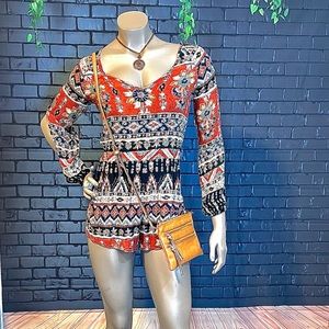 Billabong boho printed, long sleeved, V-neck romper with blues, reds and corals.